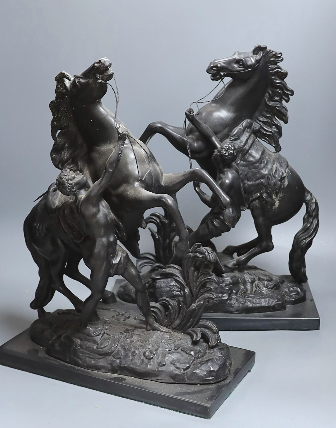 A pair of spelter Marly horse groups - 43cm tall
